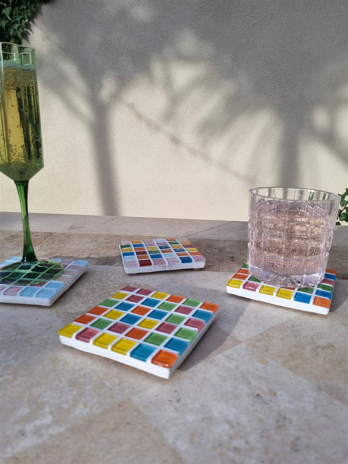 Fairy Bread coaster, bright multicoloured glass tiles on travertine