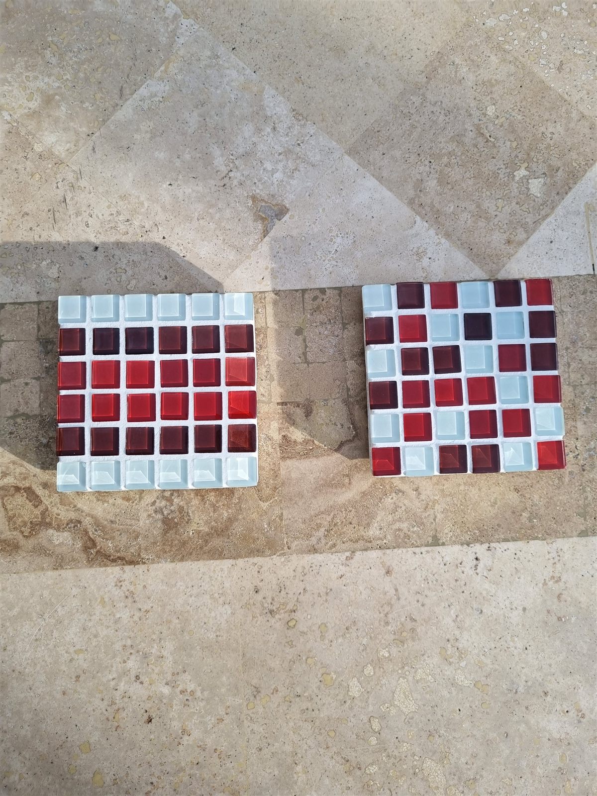Lamington and Lamington Smash coasters side by side on travertine
